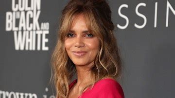 Halle Berry rocks bejeweled string bikini in stunning beach photo .